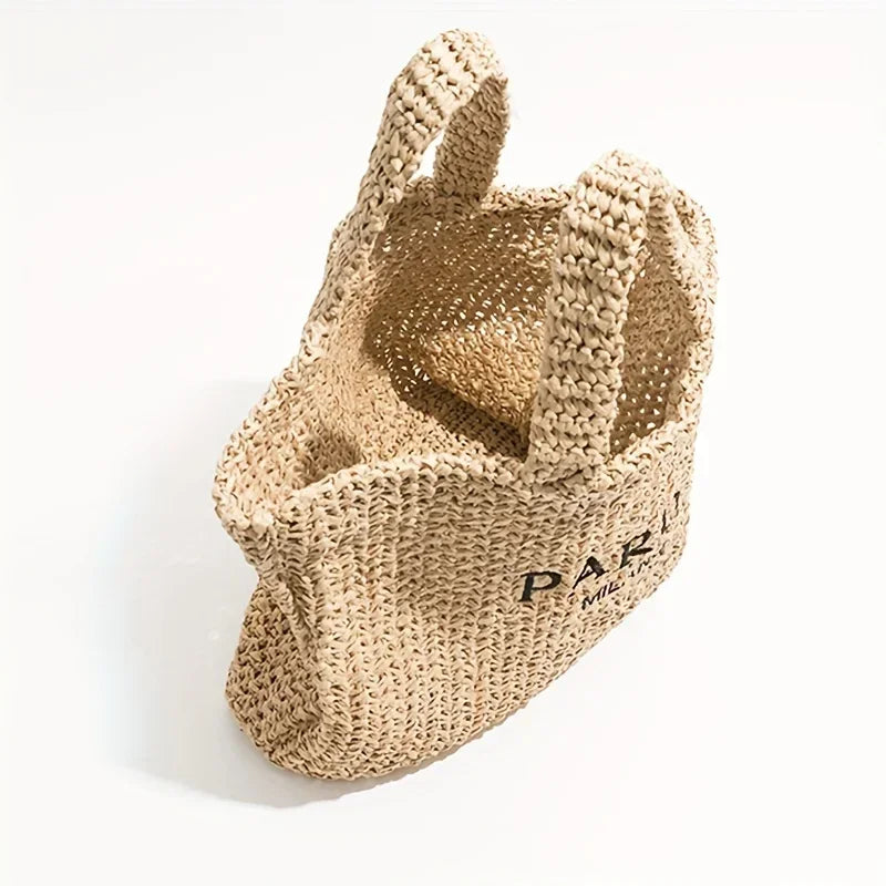Rovelli woven straw tote bag with double handles on white background