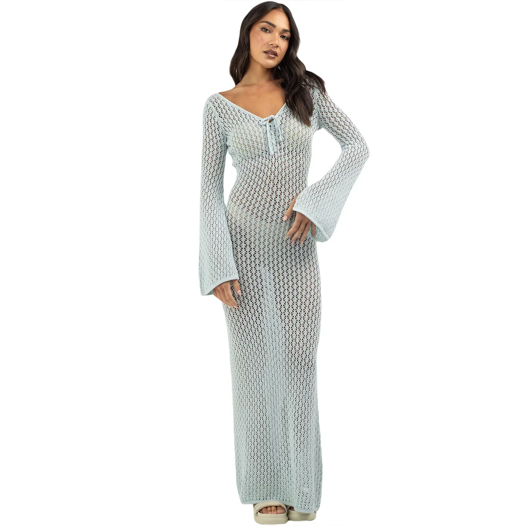 Woman wearing light blue crochet maxi dress with bell sleeves, Rovelli fashion