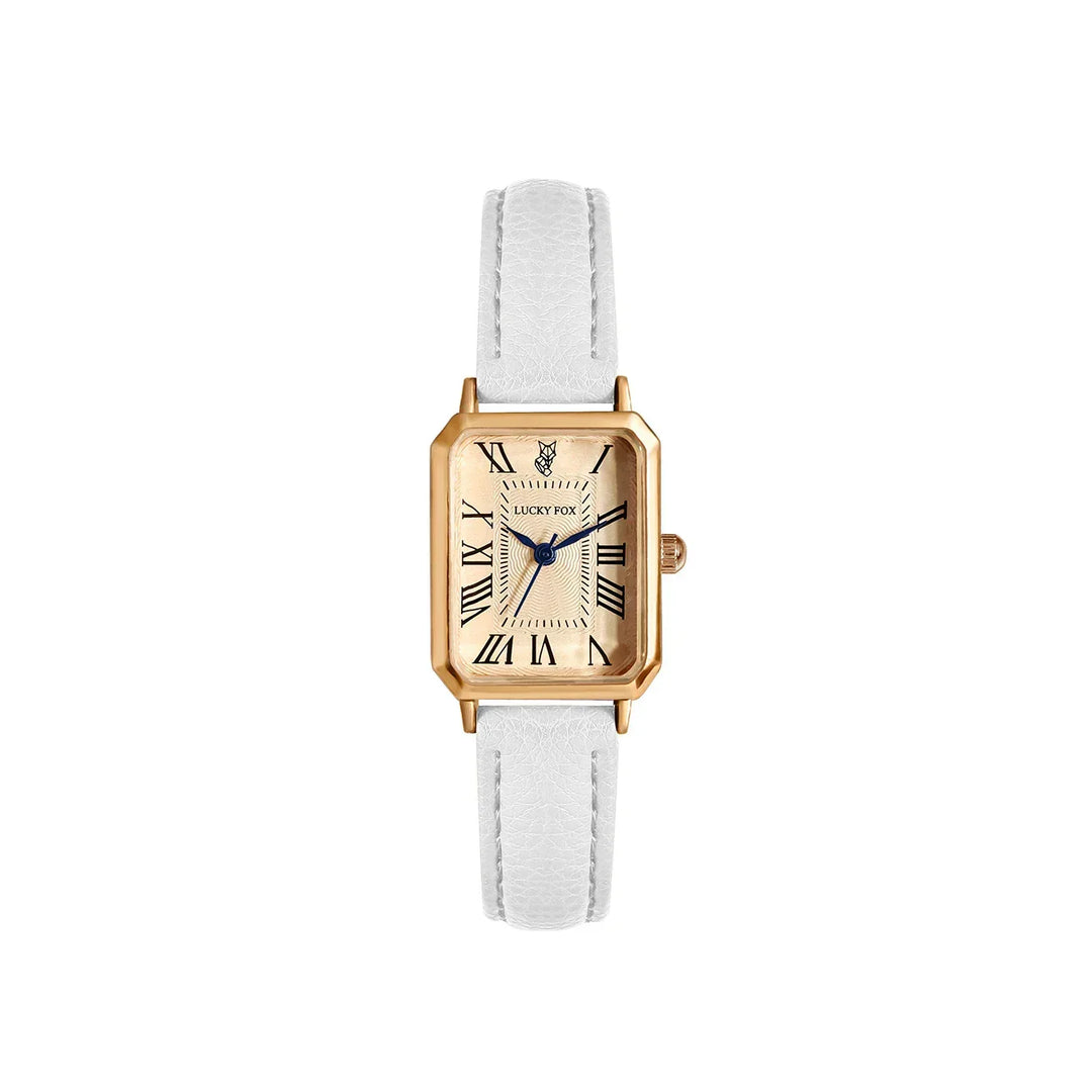 A gold rectangular face watch with a genuine leather strap, cream dial, black Roman numerals, and two black hands. The brand name LUCKY FOX and a fox logo are visible on the face.