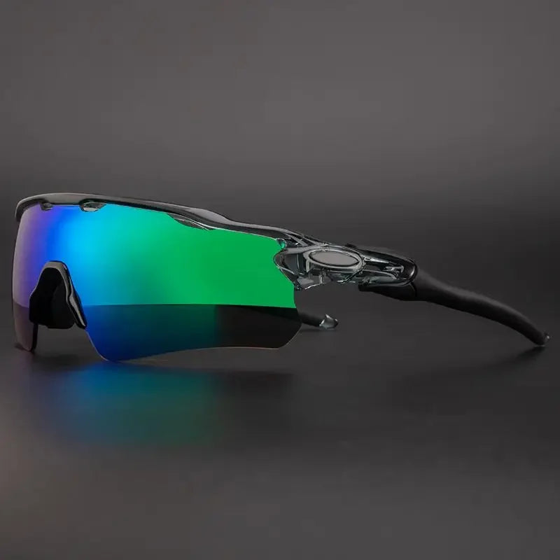 A pair of sporty polarized cycling sunglasses with a transparent frame and reflective green-tinted lenses offering UV protection, shown against a dark background.