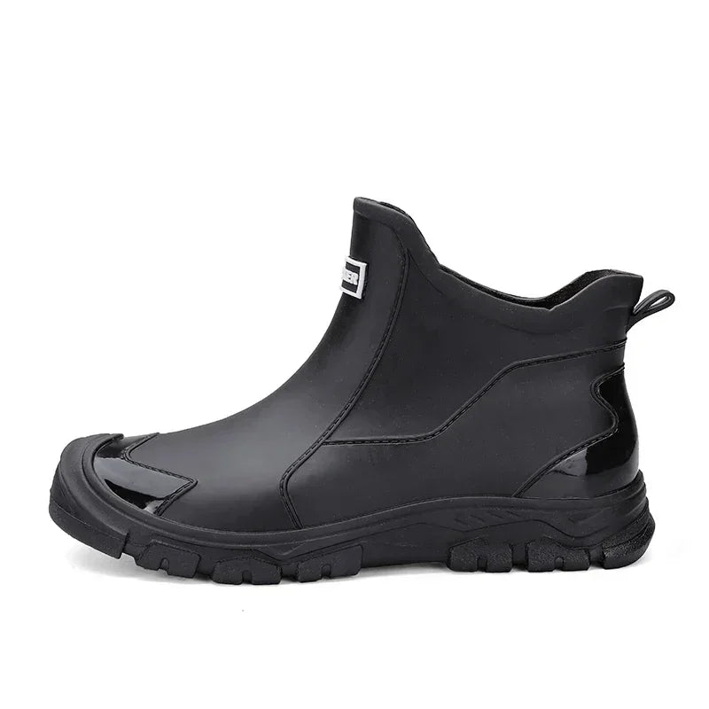 Rovelli black waterproof ankle boot with rugged sole, side logo, and pull tab