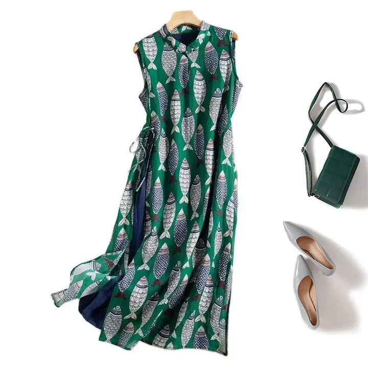 Green sleeveless fish print dress with matching handbag and gray shoes, Rovelli fashion