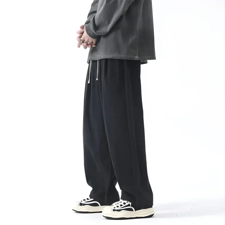 Rovelli wide leg black drawstring pants styled with black sneakers and grey top