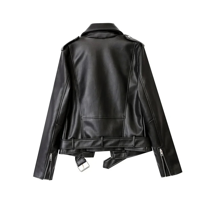 A black faux leather biker jacket shown from the back, featuring a wide collar, shoulder epaulets, silver zippers on the sleeves, and an adjustable waist belt with a large silver buckle.