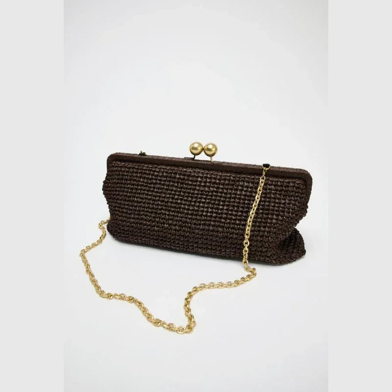 Rovelli dark brown woven clutch with gold chain and clasp on white background