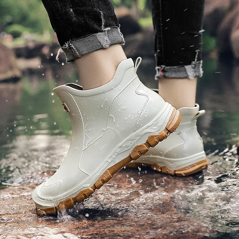 Rovelli waterproof ankle boots with tan soles in water outdoors