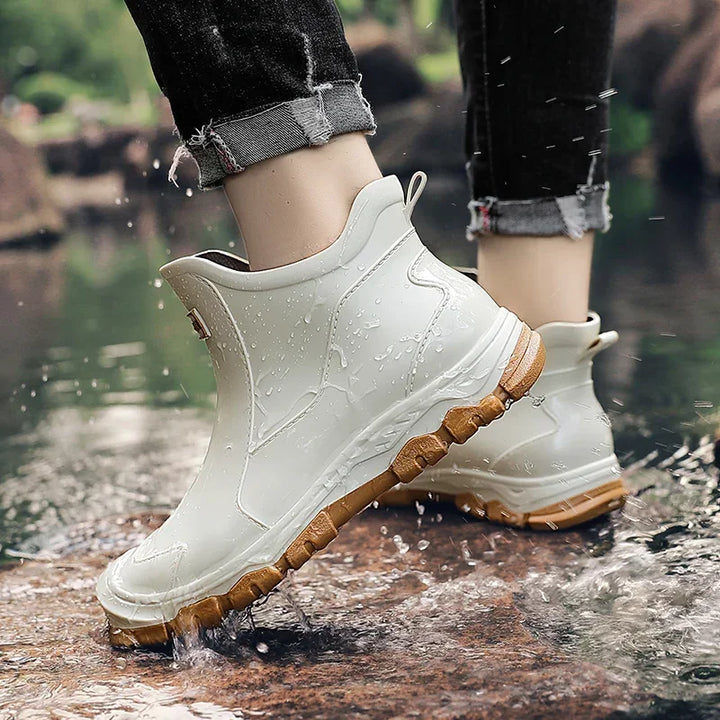 Rovelli waterproof ankle boots with tan soles in water outdoors