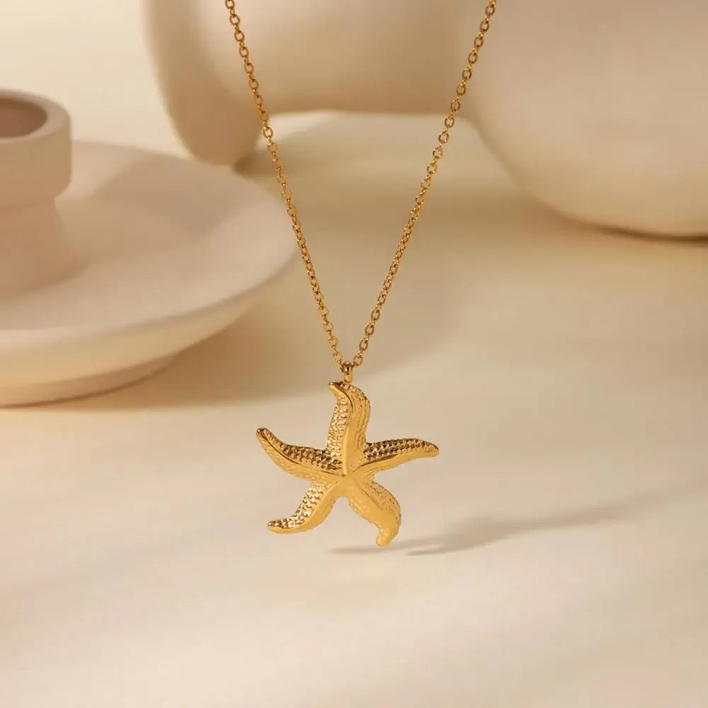 Rovelli gold starfish pendant necklace on chain, minimal elegant jewelry style