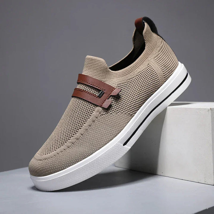 Rovelli beige knit slip-on shoe with brown strap and white sole on display