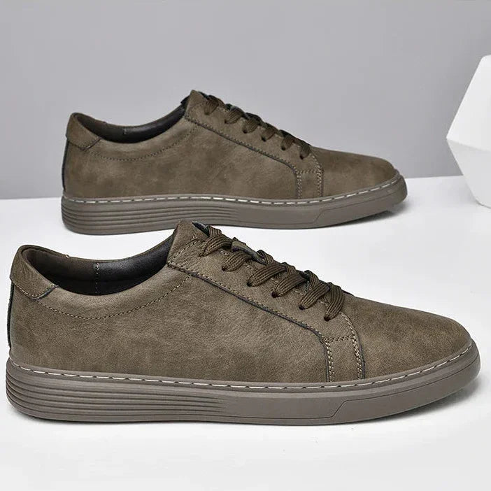 Rovelli casual brown leather sneakers with rubber soles on white surface