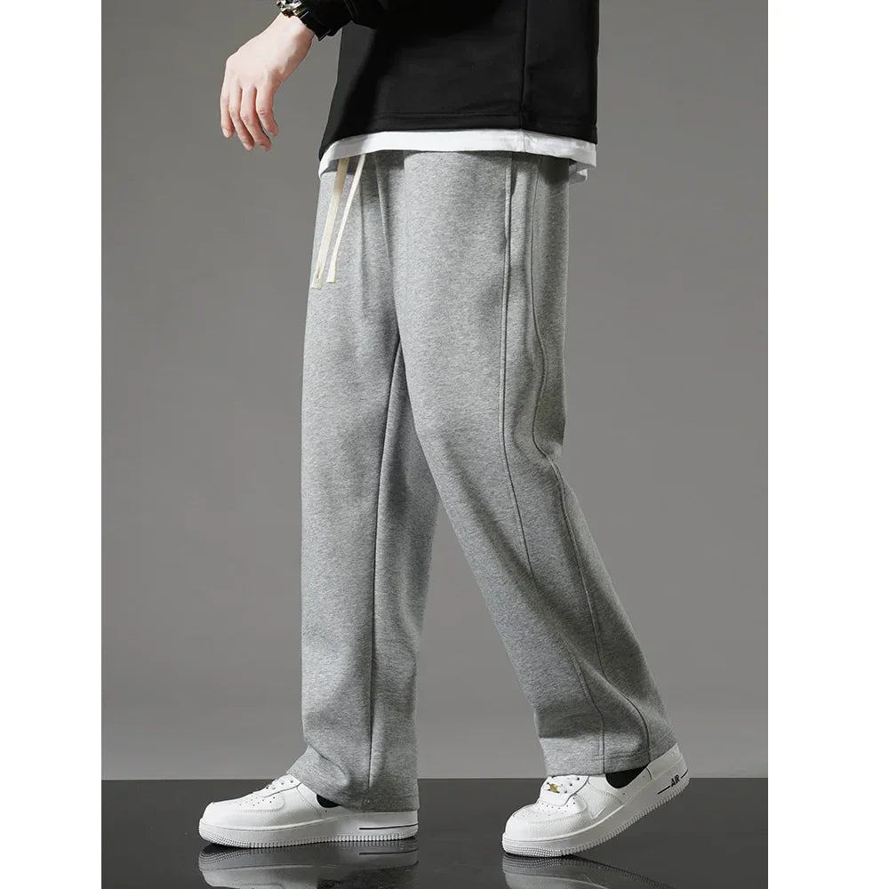 Rovelli grey sweatpants for men with drawstring waist, paired with white sneakers