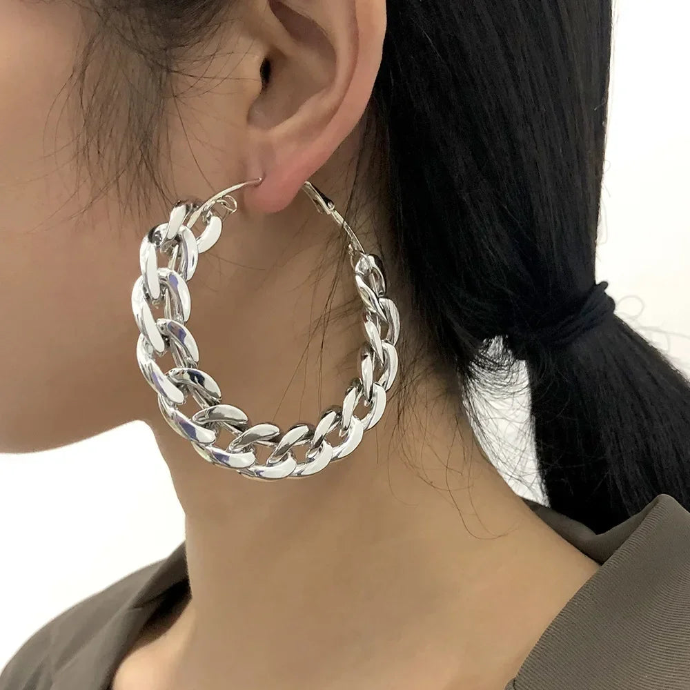 Rovelli chunky silver chain hoop earring on woman's ear