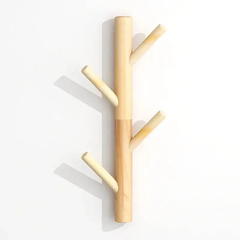 Rovelli minimalist wooden wall hook rack shaped like a tree branch on a white background