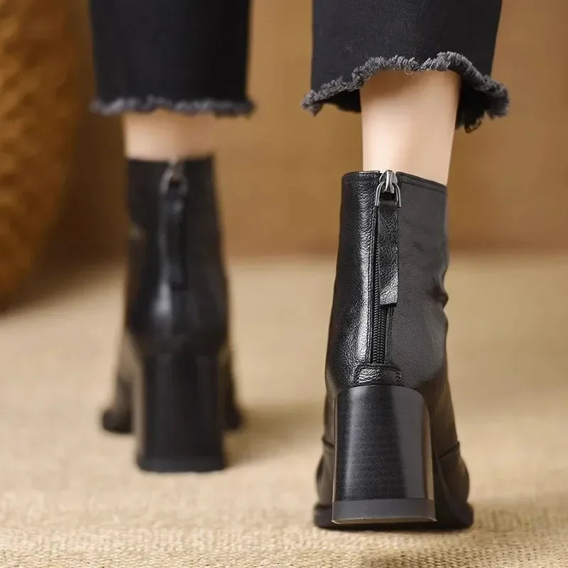 Back view black leather ankle boots with block heels, Rovelli women's fashion footwear