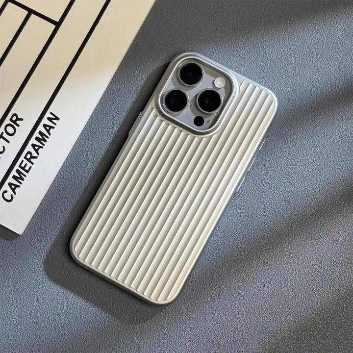 Silver ribbed iPhone case on grey surface, Rovelli minimalist phone accessory