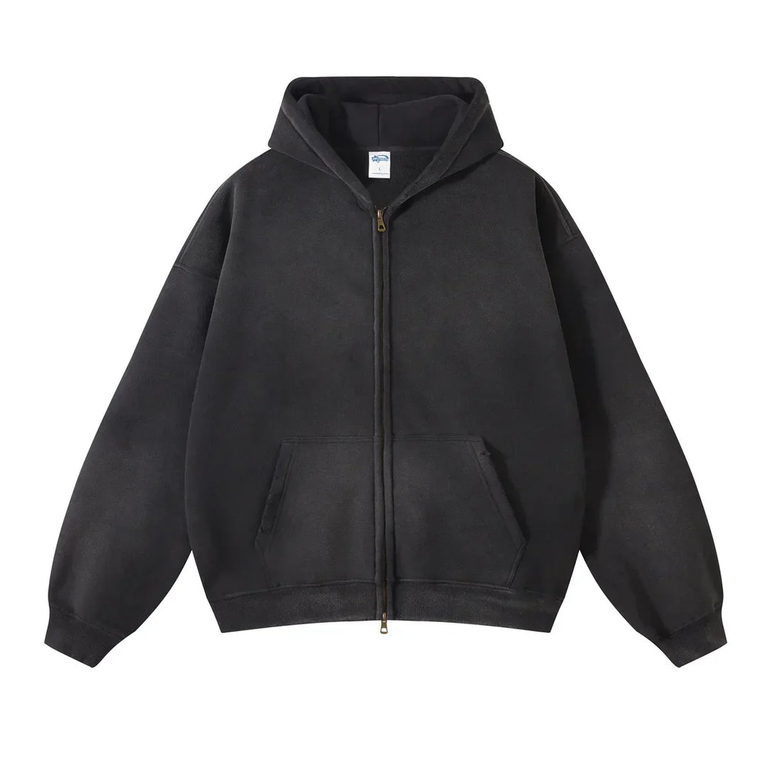 A black zip-up hoodie with a relaxed fit, thickened fabric, hood, front pockets, and long sleeves, laid flat on a white background.