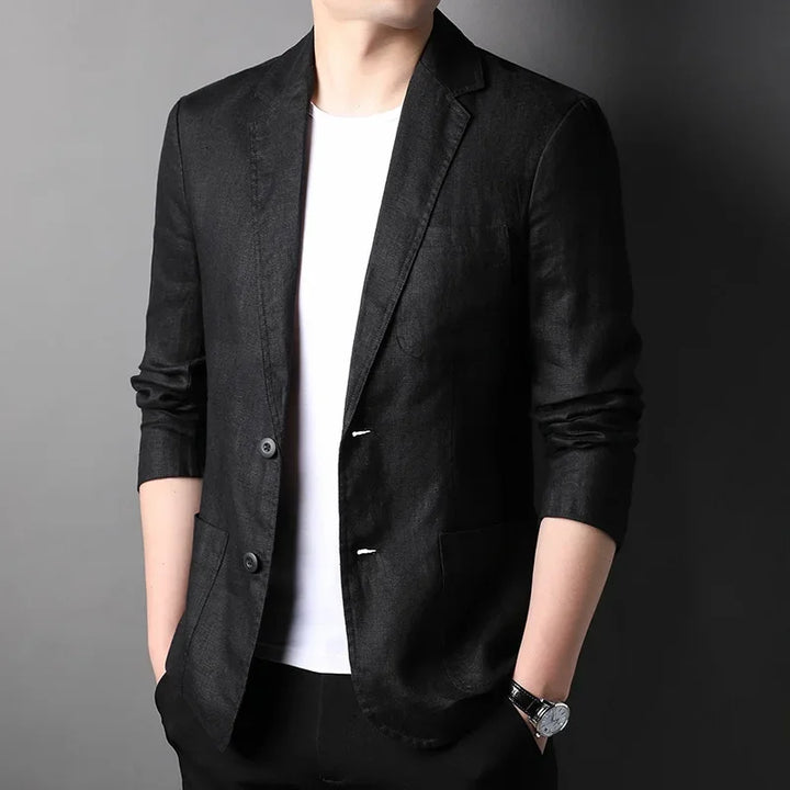 Man wearing black blazer over white shirt, Rovelli modern menswear fashion