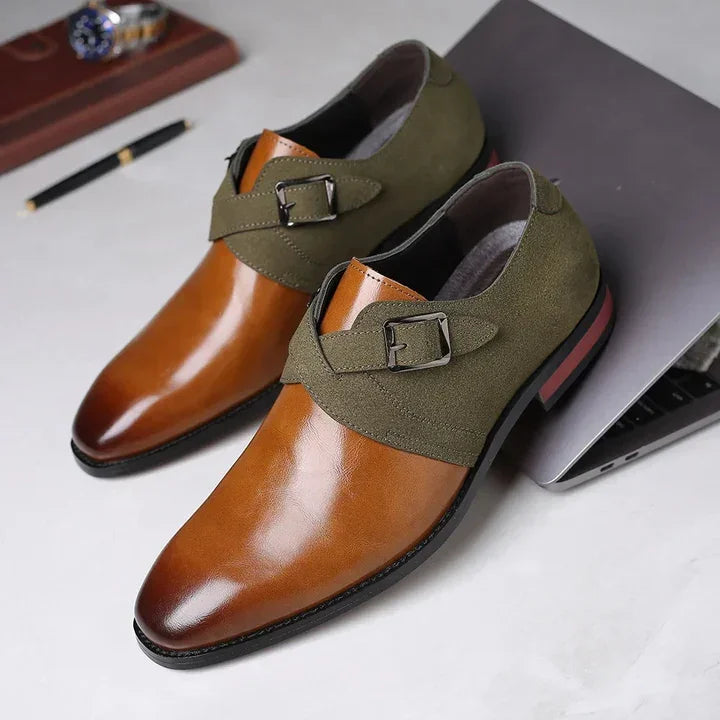 Rovelli men's monk strap dress shoes, brown leather and green suede, on a desk near a laptop
