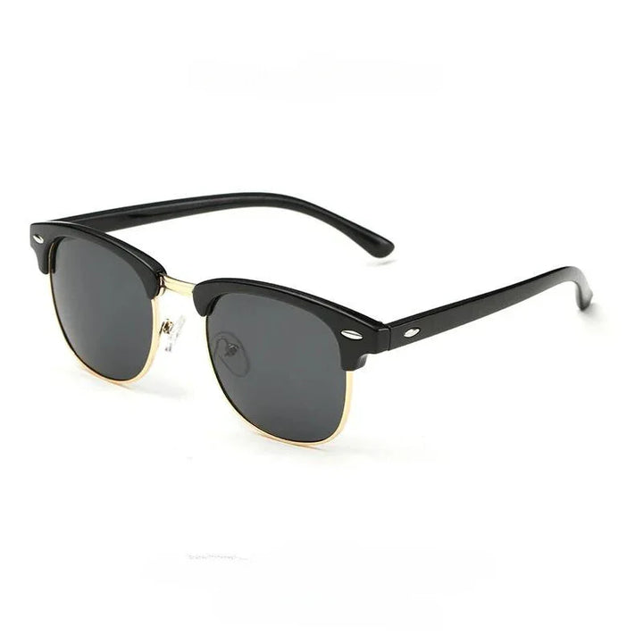 A pair of black and gold clubmaster-style vintage sunglasses with dark lenses, featuring a black top frame, gold lower rims, and black arms with silver accents near the hinges for classic style and UV protection.