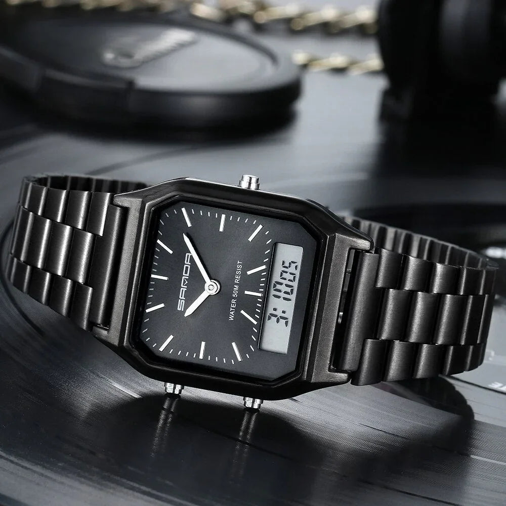 A black Luxury G Style dual display wristwatch with both analog and digital time is shown resting on a dark, reflective surface. White hour markers and hands complement the digital readout, displaying 3:10:05.