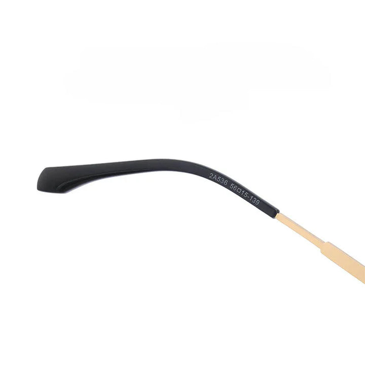 A close-up of a single eyeglass temple arm, featuring a black plastic tip and gold-tone stem with numbers printed on it, evokes the refined elegance of vintage-inspired sunglasses against a plain white background.
