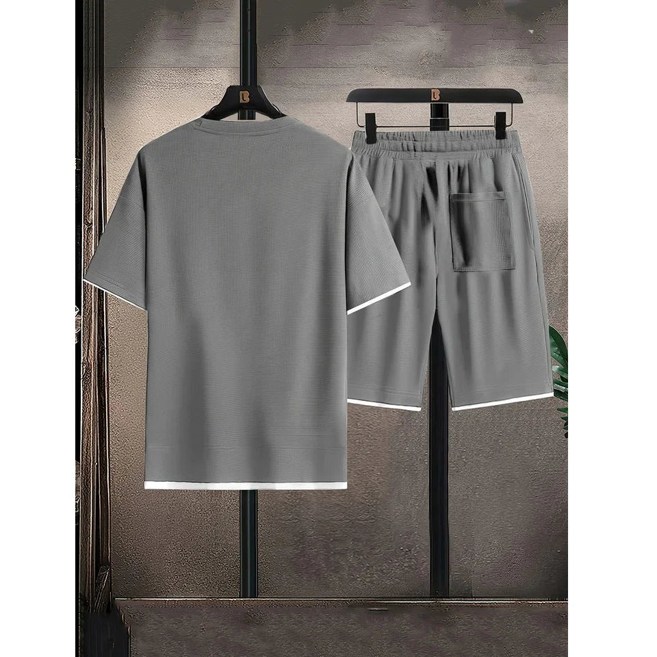 Rovelli gray short sleeve shirt and shorts lounge set with white trim, rear view
