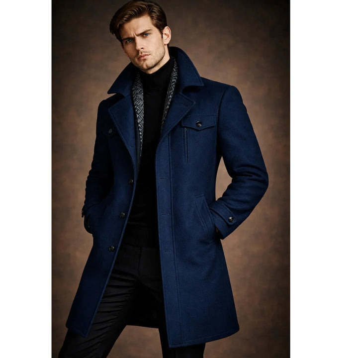 Man wearing Rovelli navy blue wool coat with black turtleneck, hands in pockets, fashion shoot