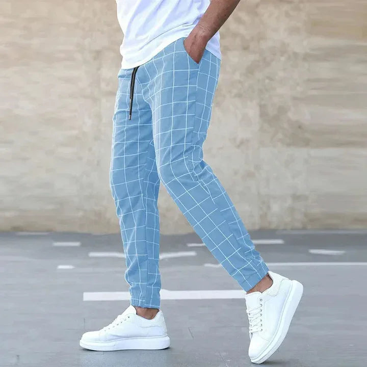 Rovelli light blue grid print jogger pants with drawstring, white sneakers, outdoor style