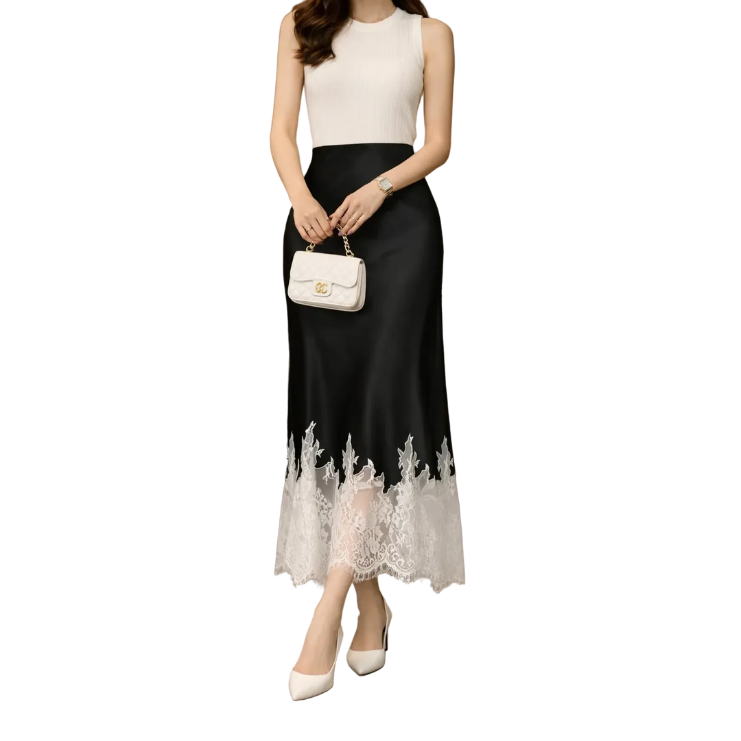 Elegant sleeveless dress with black skirt, lace hem, white top, and chic purse by Rovelli