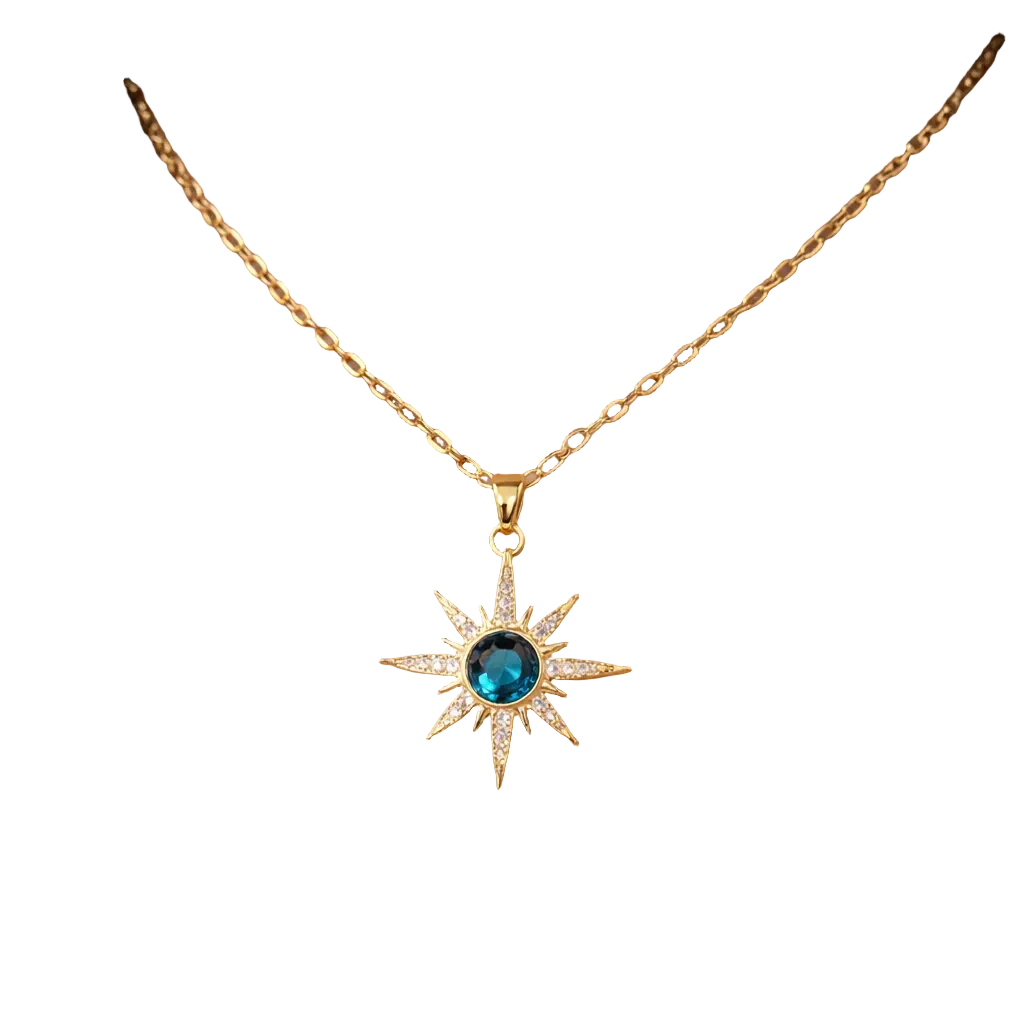 Rovelli gold starburst necklace with blue gemstone pendant on black background