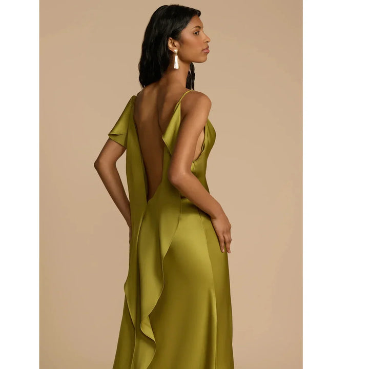 Woman wearing olive green satin ruffle dress with deep back, Rovelli fashion