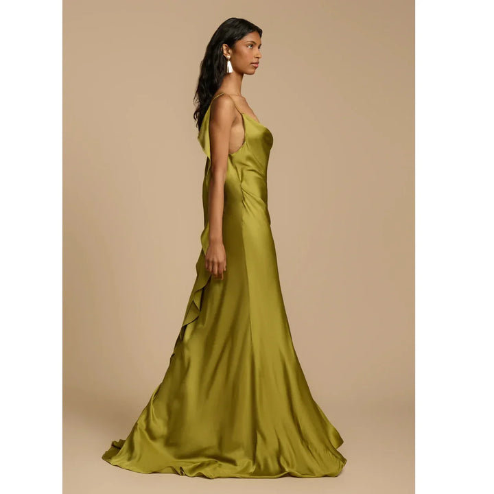 Woman wearing olive green satin evening gown, Rovelli fashion, side profile, neutral background