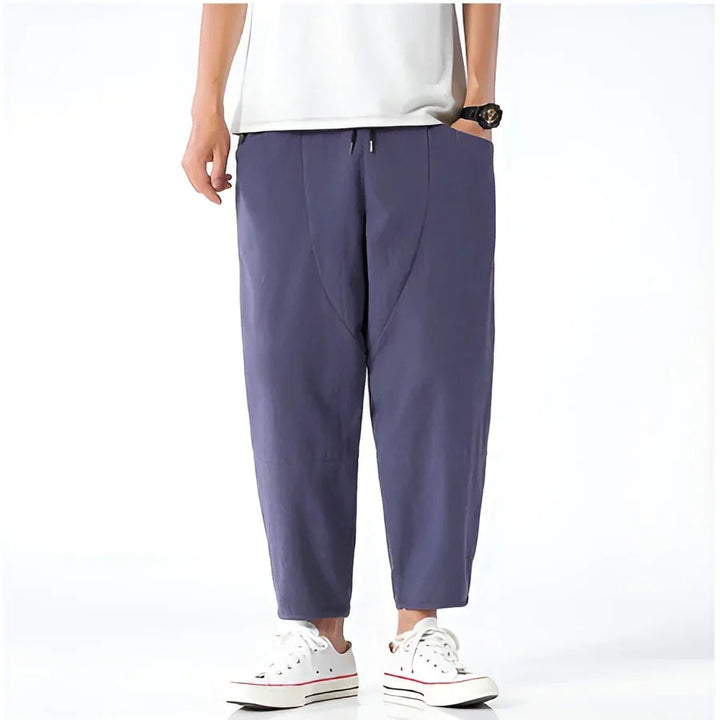 Rovelli slate blue cropped pants with relaxed fit, styled with white sneakers