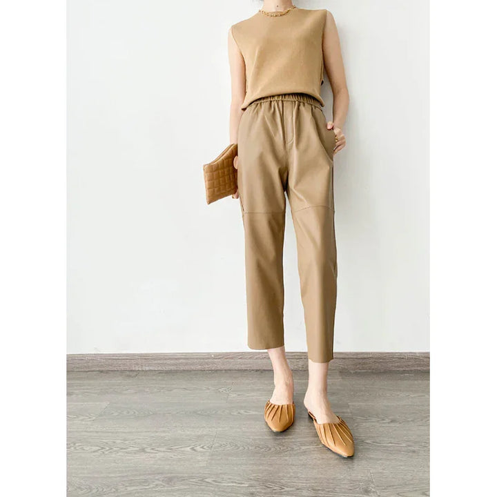 Rovelli beige leather pants, sleeveless top, and tan flats on model, minimalist setting