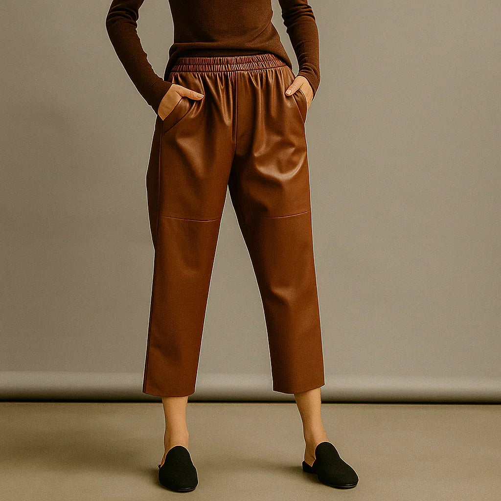 Rovelli brown faux leather pants with elastic waist, cropped fit, studio background