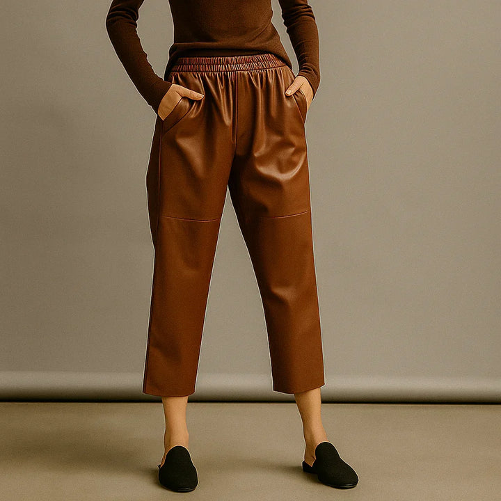 Rovelli brown faux leather pants with elastic waist, cropped fit, studio background