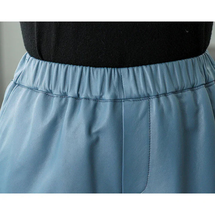 Closeup of Rovelli light blue faux leather pants with elastic waistband