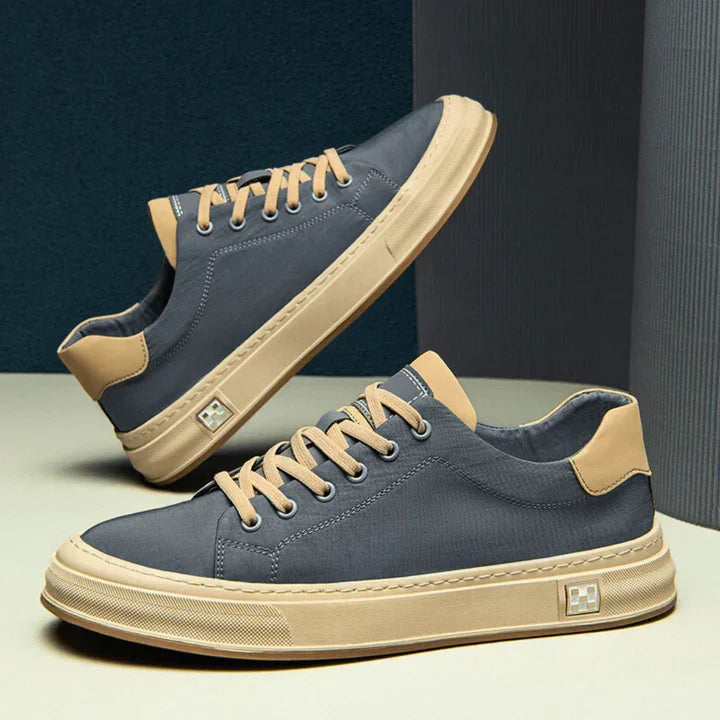 Rovelli Ariston sneaker in gray with beige sole and accents on display