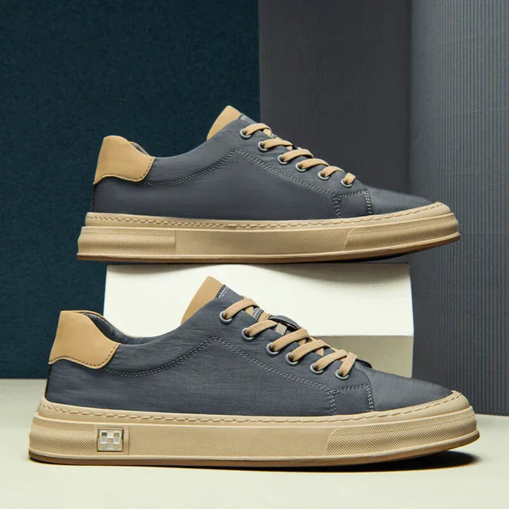 Rovelli stylish blue and tan leather sneakers with beige sole, side view product display