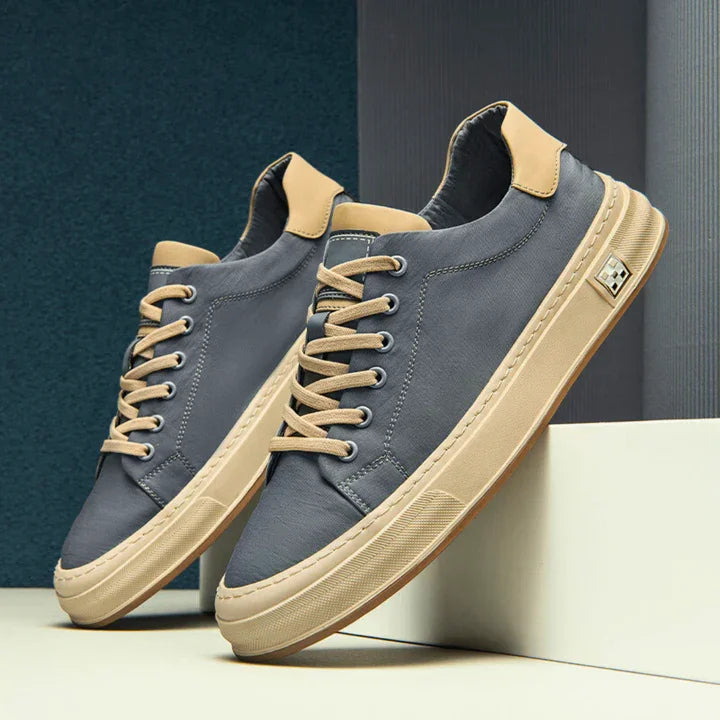 Rovelli Ariston sneaker in blue with tan sole and laces, modern footwear display