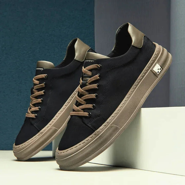 Rovelli Ariston black sneakers with tan soles and laces on modern display