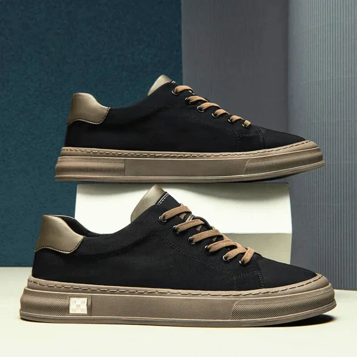 Rovelli black Ariston sneakers with tan soles and laces, modern background