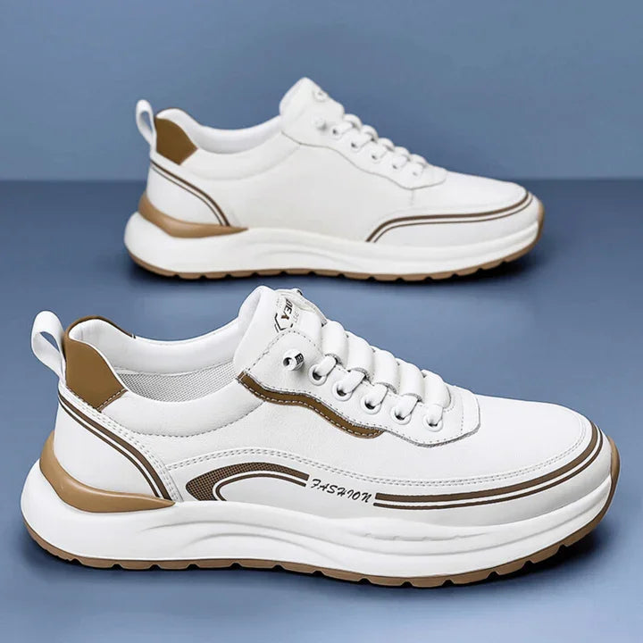 Rovelli white and beige sneakers with thick sole, side detail, and lace-up design on blue background.
