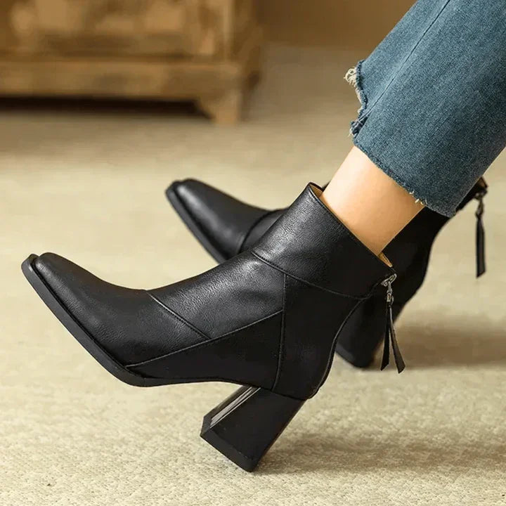 Rovelli black leather ankle boots with block heel and zipper, worn with blue jeans