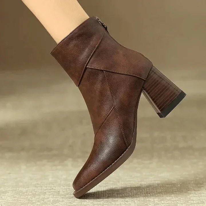 Rovelli brown leather ankle boot with block heel on neutral background