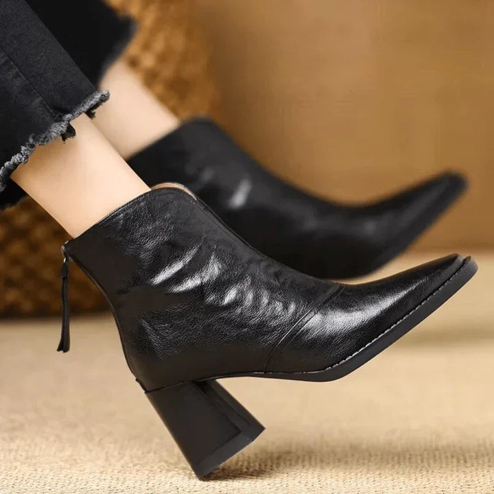 Rovelli black leather ankle boots with block heels and pointed toe, worn with black jeans
