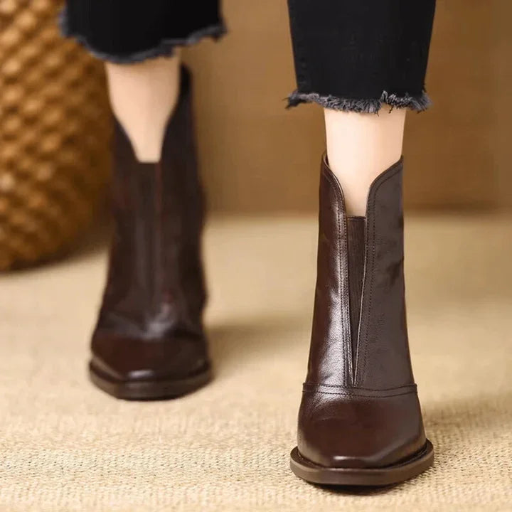 Rovelli dark brown leather ankle boots with pointed toe, worn with black frayed hem jeans