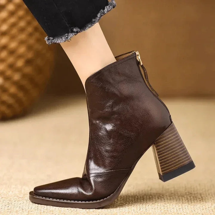 Rovelli dark brown leather heeled boot with side zipper, worn with frayed black jeans